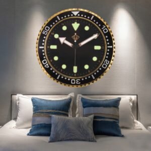 Modern wall clock with brushed gold rim and white minimalist dial hanging on neutral dining room wall