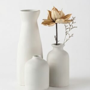 Bohemian ceramic vase set of 3 in neutral tones on a wooden dining table