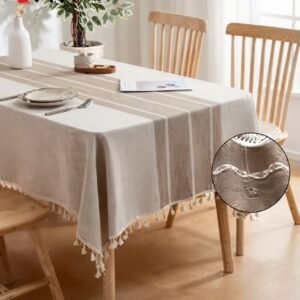 Cotton linen waterproof tablecloth on a wooden dining table with ceramic vase
