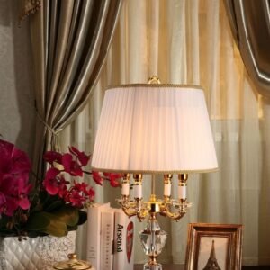 Luxury crystal table lamp glowing on a bedroom nightstand