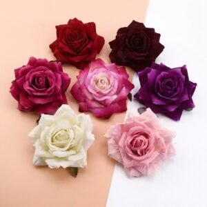 Pile of soft flannel rose flower heads in mixed colours for DIY crafts