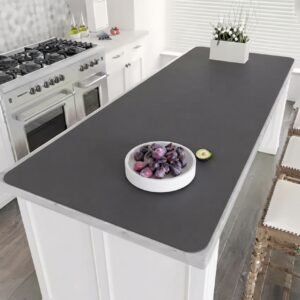 Extra large silicone table mat covering a dining table with a hot dish on top