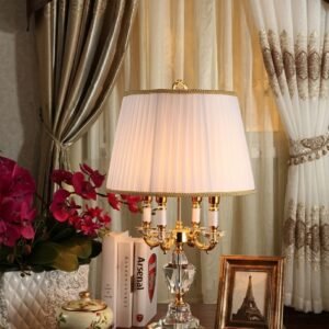 Luxury crystal table lamp glowing on a bedroom nightstand