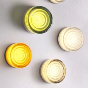Nordic LED wall lamp with jelly design glowing in a hallway
