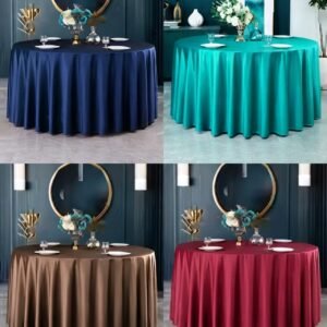 Round satin tablecloth in a solid neutral color on a dining table with a vase